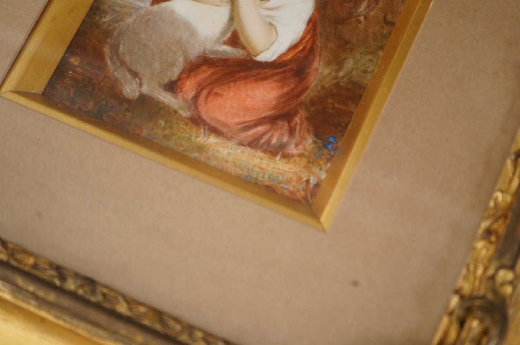 A Continental painted porcelain plaque of Saskia van Uylenburgh, after Rembrandt, together with another plaque of a young girl and her dog, after John Russell (2), Largest 17cm wide x 24cm high.